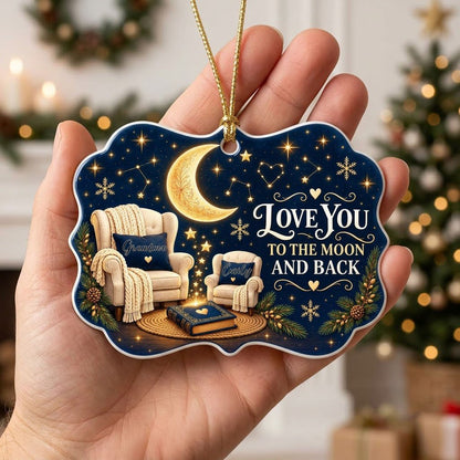 Medallion ceramic ornament with golden moon, stars, two chairs, and 'LOVE YOU TO THE MOON AND BACK' text.