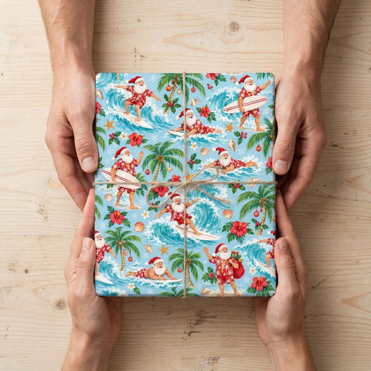 Surfing Santa with palm trees, hibiscus, starfish and seashells on light blue tropical wrapping paper.