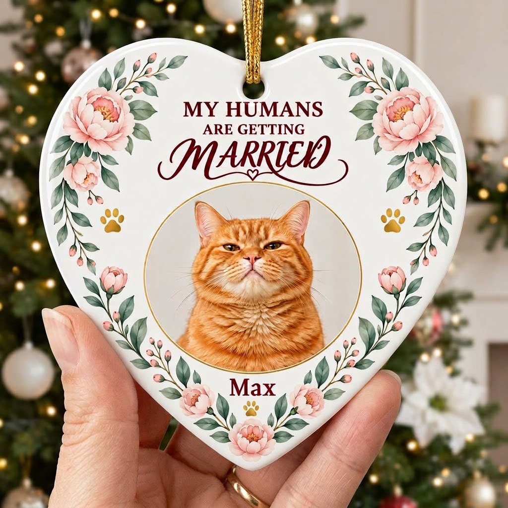 Heart ceramic ornament with 'My Humans Are Getting Married,' a cat photo, pink florals, gold paw prints, and a heart ico