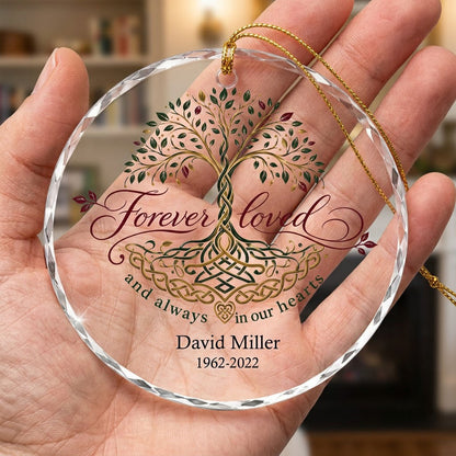 Round glass ornament with Celtic Tree of Life in green, gold and red, reading Forever loved and always in our hearts.