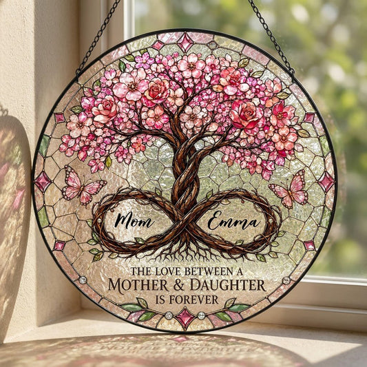 Round suncatcher with tree of life, pink blossoms, and 'THE LOVE BETWEEN A MOTHER & DAUGHTER IS FOREVER'