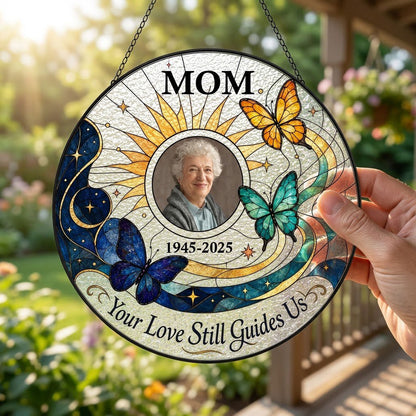 Round stained glass-style suncatcher with a photo frame, three butterflies, a crescent moon, sunburst rays and a banner 