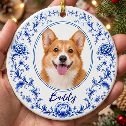Round ceramic ornament with blue Delft floral border framing a circular photo of a dog and a personalized name.
