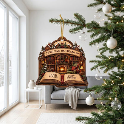 Custom-cut wood ornament with arched loop and open book base, cozy bookshop scene with tree, fireplace, armchair.
