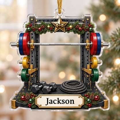 A squat rack-shaped acrylic ornament with garland, barbell, dumbbells, and a photo cutout above a name plaque.