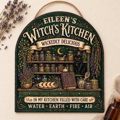 Arch wooden sign with black cat, apothecary jars, lavender, crescent moon and stars, and the text WITCH'S KITCHEN.