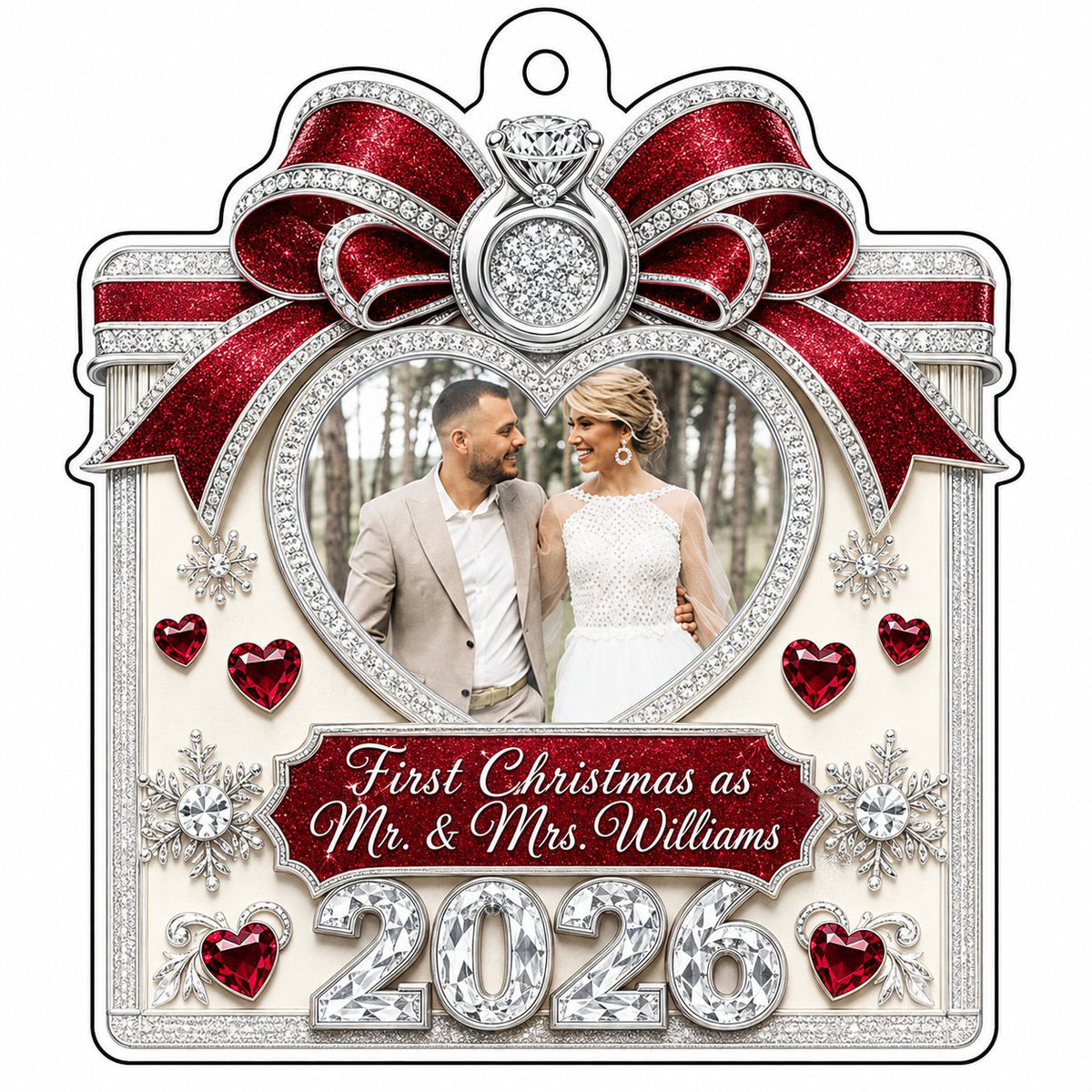 Acrylic ornament with red glitter bow, engagement ring, heart photo frame, snowflakes, and Mr. & Mrs. name and year.