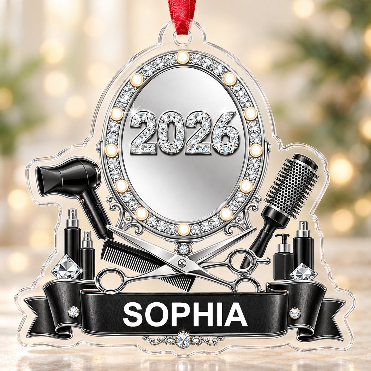 Clear acrylic ornament with a lit vanity mirror and salon tools, featuring SOPHIA and 2026 on a black banner.