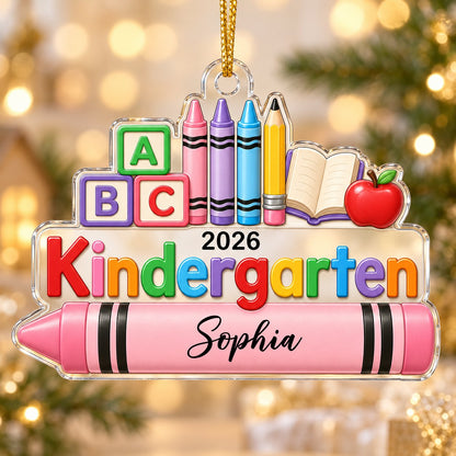 Clear acrylic ornament with ABC blocks, crayons, apple, open book and 'Kindergarten 2026' with a pink name banner
