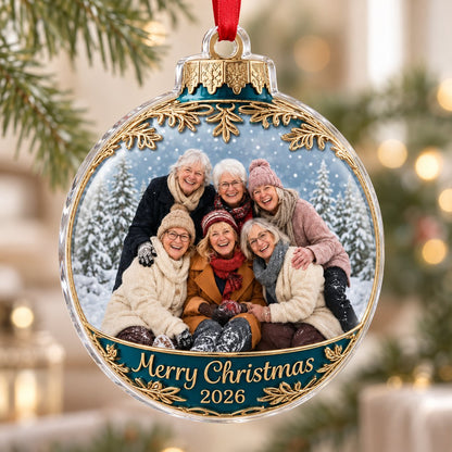 Clear acrylic bauble ornament with photo of six women in snowy pines, gold filigree, teal banner and Merry Christmas tex