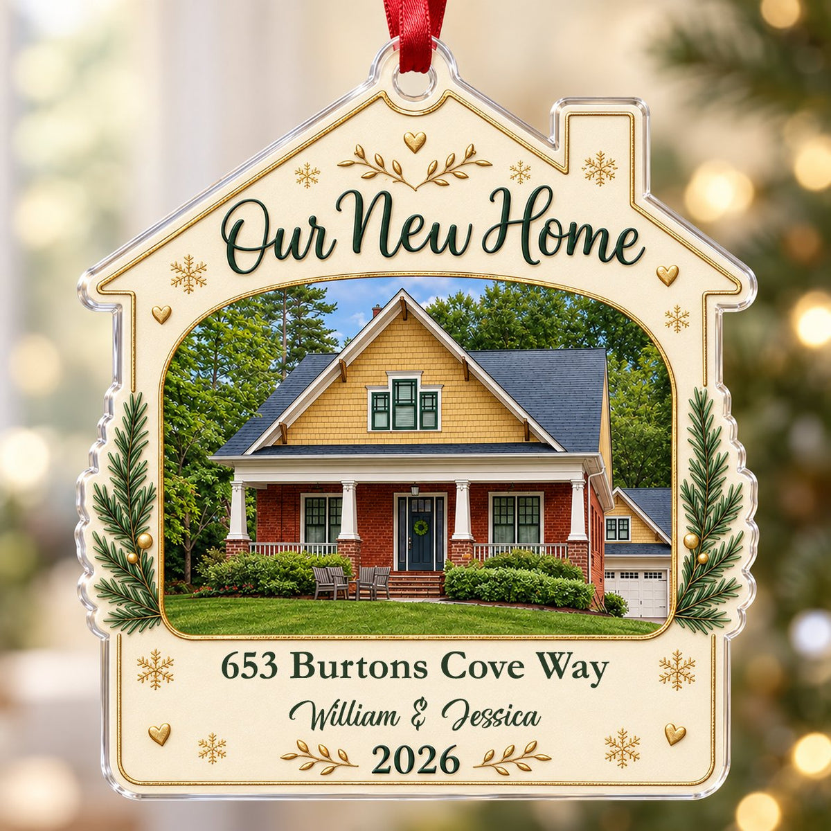 House-shaped acrylic ornament with “Our New Home”, a house photo frame, pine boughs, gold hearts and snowflakes.