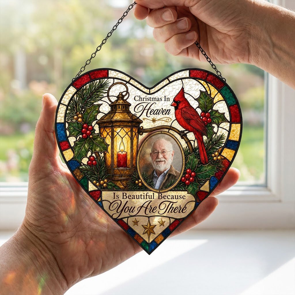Heart stained glass suncatcher with lantern, red candle, red cardinal, holly, pine, and an oval photo frame.