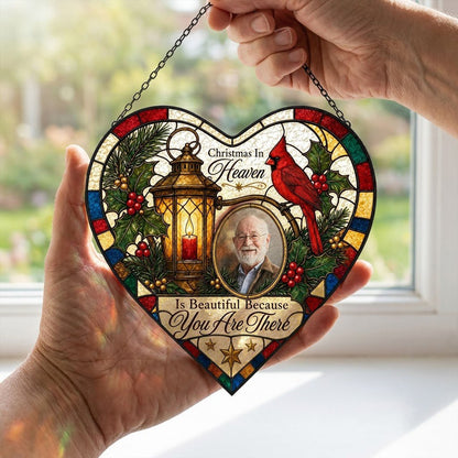 Heart stained glass suncatcher with lantern, red candle, red cardinal, holly, pine, and an oval photo frame.