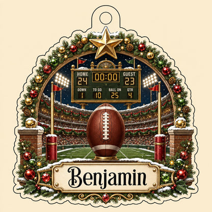 Acrylic ornament with football on a tee, stadium scoreboard, and pine garland border with a name banner.