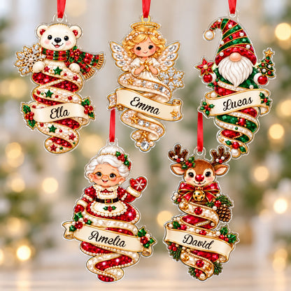 A custom-cut clear acrylic ornament shows a polar bear and Mrs. Claus in a jeweled spiral with a name banner and red rib
