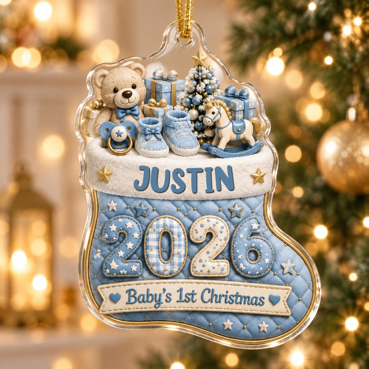 Blue quilted stocking ornament with teddy bear, baby toys, Baby's 1st Christmas text, and name and year.