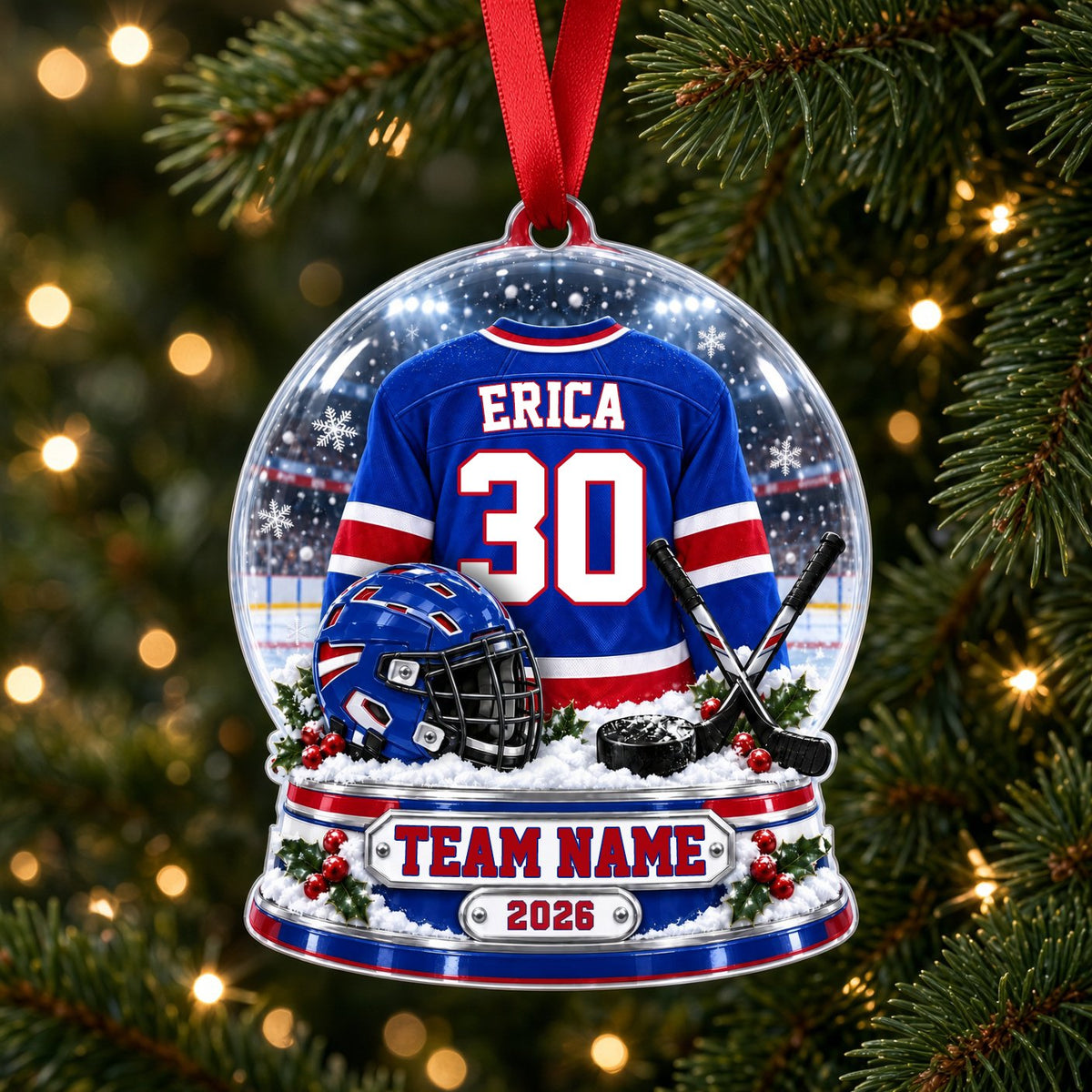A custom-cut snow globe acrylic ornament with hockey jersey, helmet, crossed sticks, puck, and holly on the base.