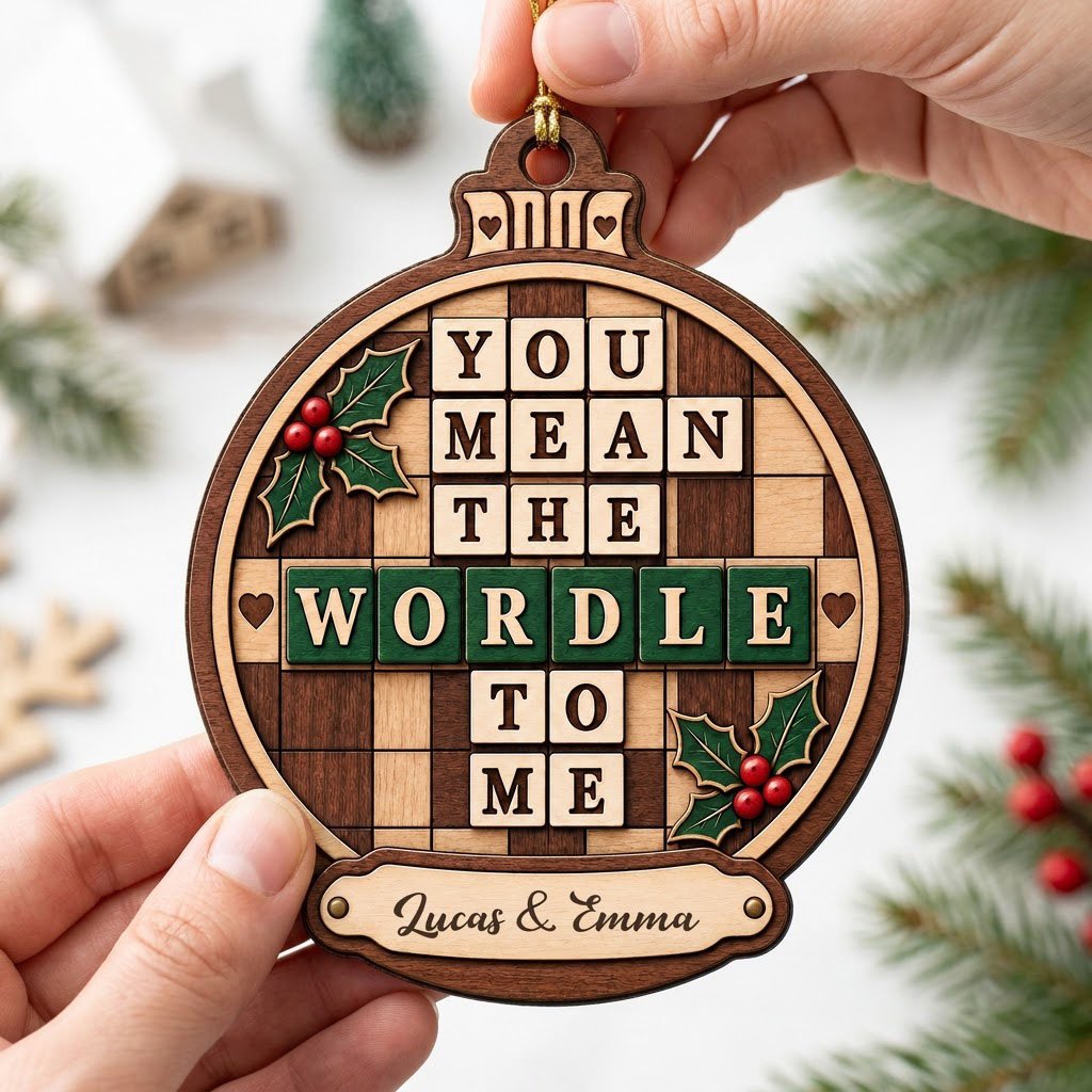 Bauble wood ornament with 'You Mean The Wordle To Me', green WORDLE tiles, holly and personalized names