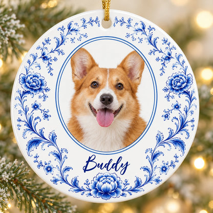 Round ceramic ornament with blue Delft floral border framing a circular photo of a dog and a personalized name.