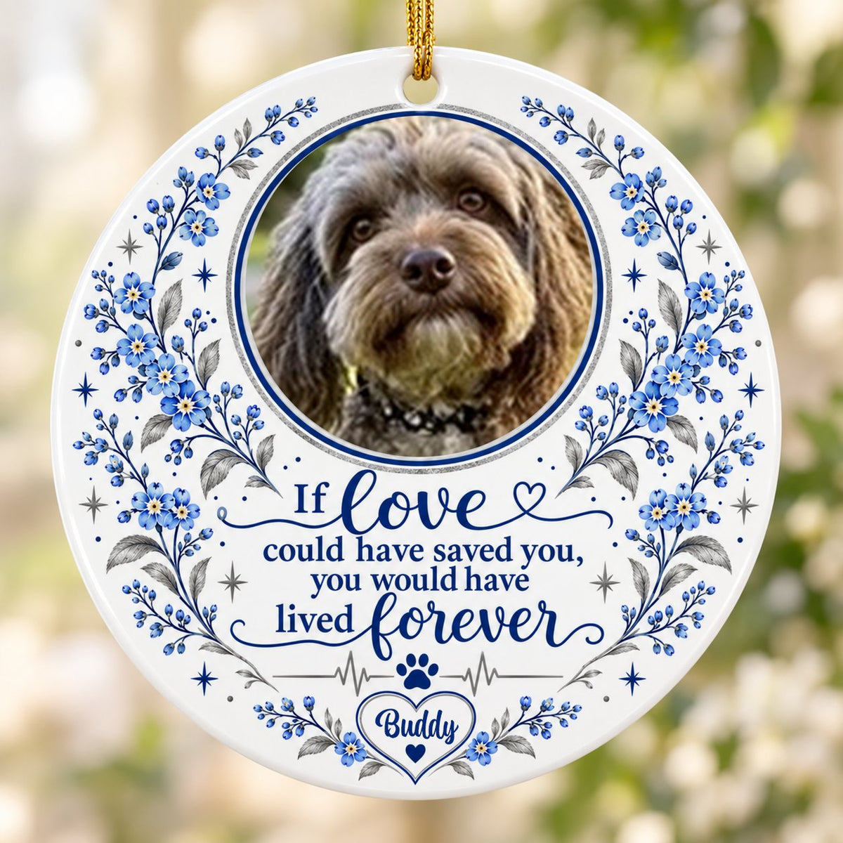 Round ceramic ornament with pet photo, blue forget-me-not florals, paw heartbeat line, and memorial quote.