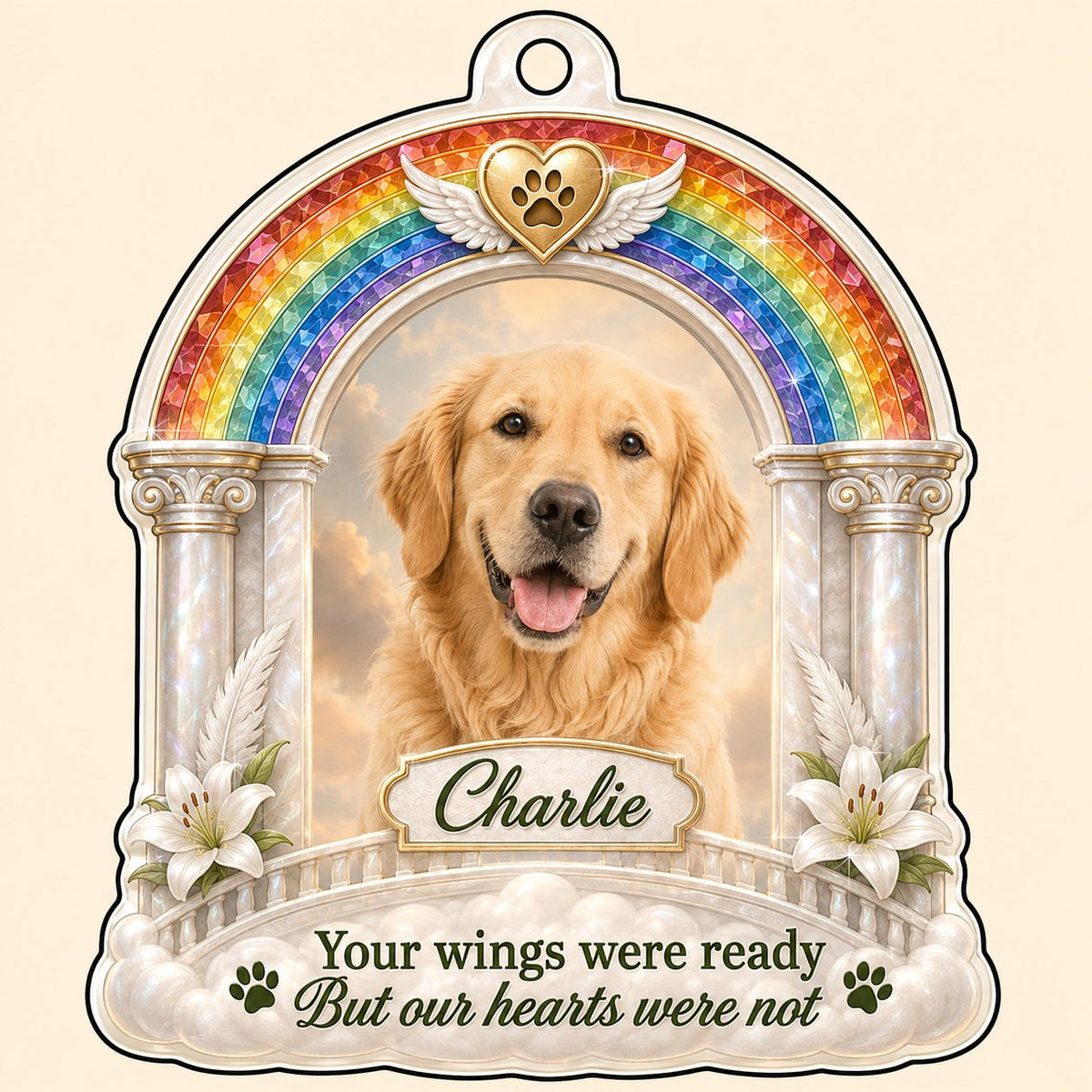 A rainbow arch pet memorial acrylic ornament with a winged golden heart, paw print, lilies, pillars, clouds and a photo 