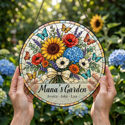 Round stained-glass style suncatcher with floral bouquet, butterflies, and 'Mana's Garden' with names.