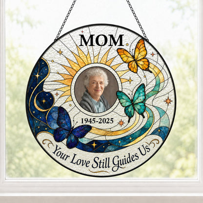 Round stained glass-style suncatcher with a photo frame, three butterflies, a crescent moon, sunburst rays and a banner 
