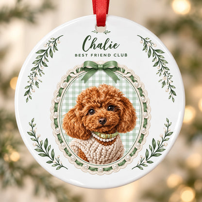 Round ceramic ornament with a poodle portrait, 'BEST FRIEND CLUB', green gingham, bow, and leafy sprigs.