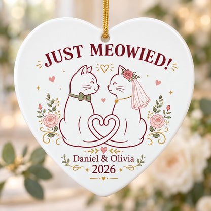 Two white cats with bow tie and bridal veil under JUST MEOWIED with roses and stars on a heart ceramic ornament.