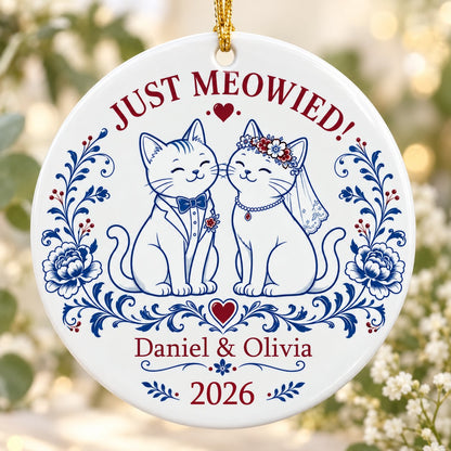Round ceramic ornament with two wedding cats, 'JUST MEOWIED!', names and year with blue and red folk floral accents