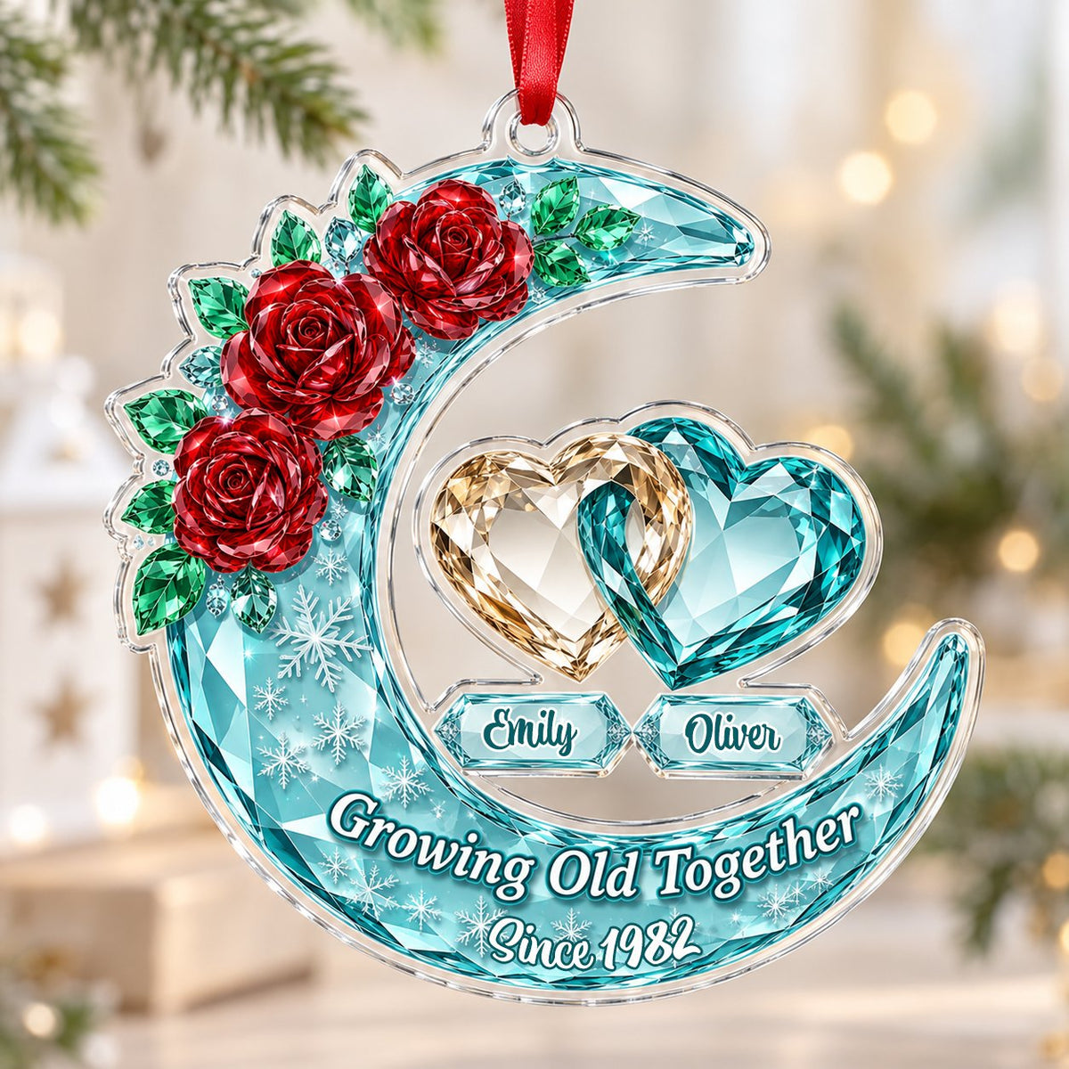 Custom-cut acrylic ornament of a faceted crescent moon with red roses, snowflakes, and two intertwined crystal hearts.