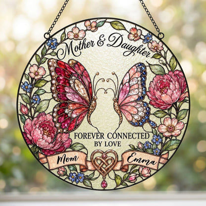 Round stained-glass style suncatcher with two butterflies, pink peonies and a ribbon banner for Mother & Daughter.