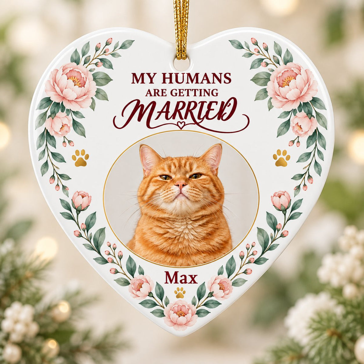 Heart ceramic ornament with 'My Humans Are Getting Married,' a cat photo, pink florals, gold paw prints, and a heart ico
