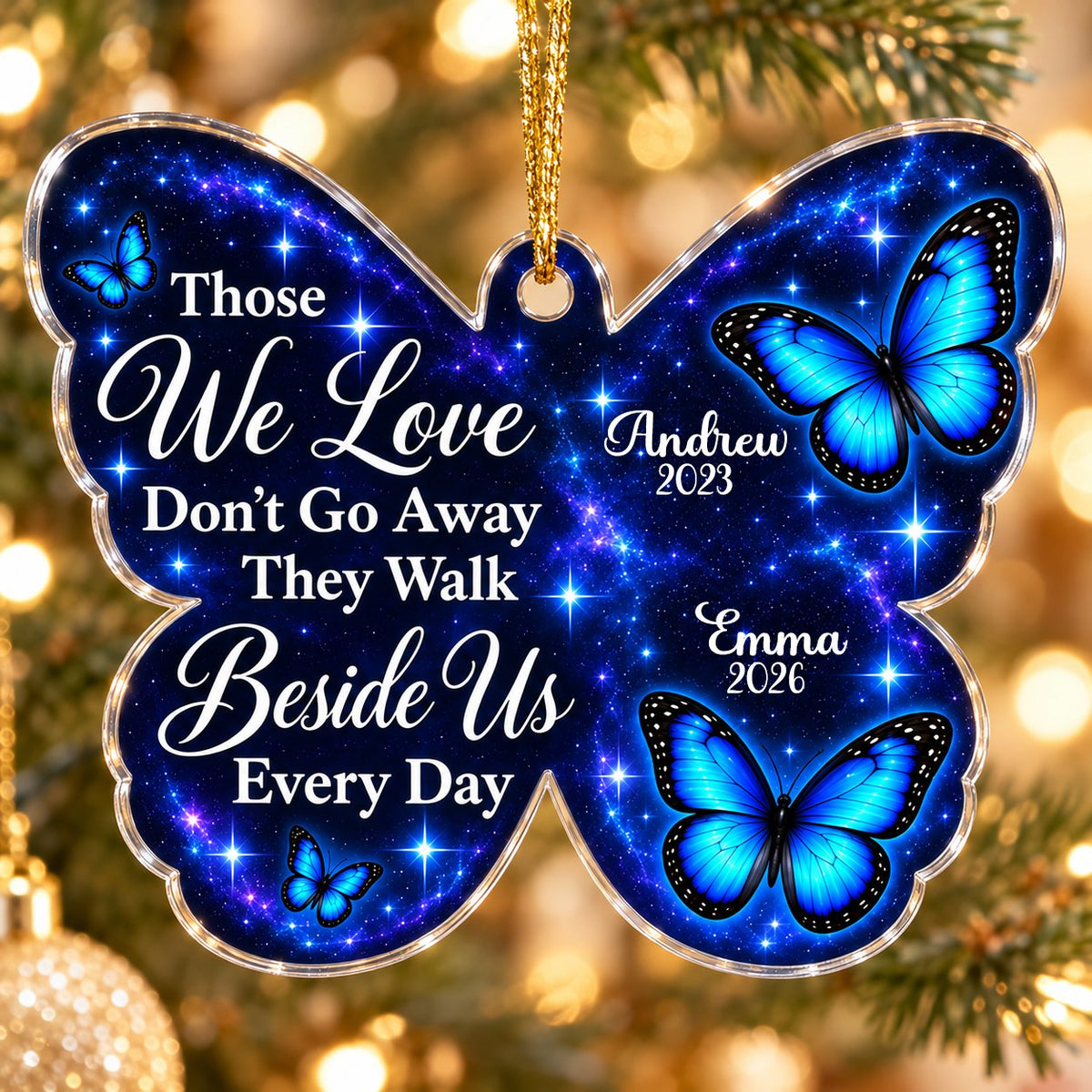 Butterfly-shaped ornament with blue butterflies and a galaxy background, reading Those We Love Don't Go Away.