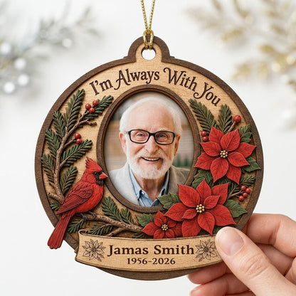 Bauble-shaped wood ornament with oval photo frame, red cardinal, pine, berries, and poinsettias with ribbon banner