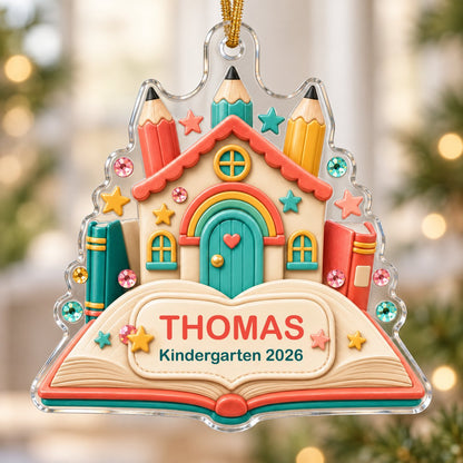 Clay-style schoolhouse on an open book with pencils and stars, personalized with child's name and Kindergarten 2026