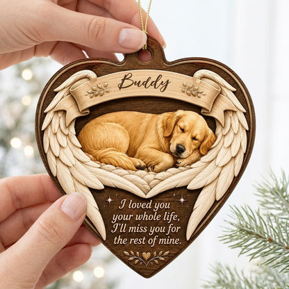 Heart-shaped wood ornament with a sleeping golden retriever, angel wings, ribbon banner, stars, and a memorial quote.