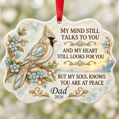 Ceramic medallion ornament with a jewel-encrusted blue bird, blue flowers, gold filigree, and a sunrise lake background.