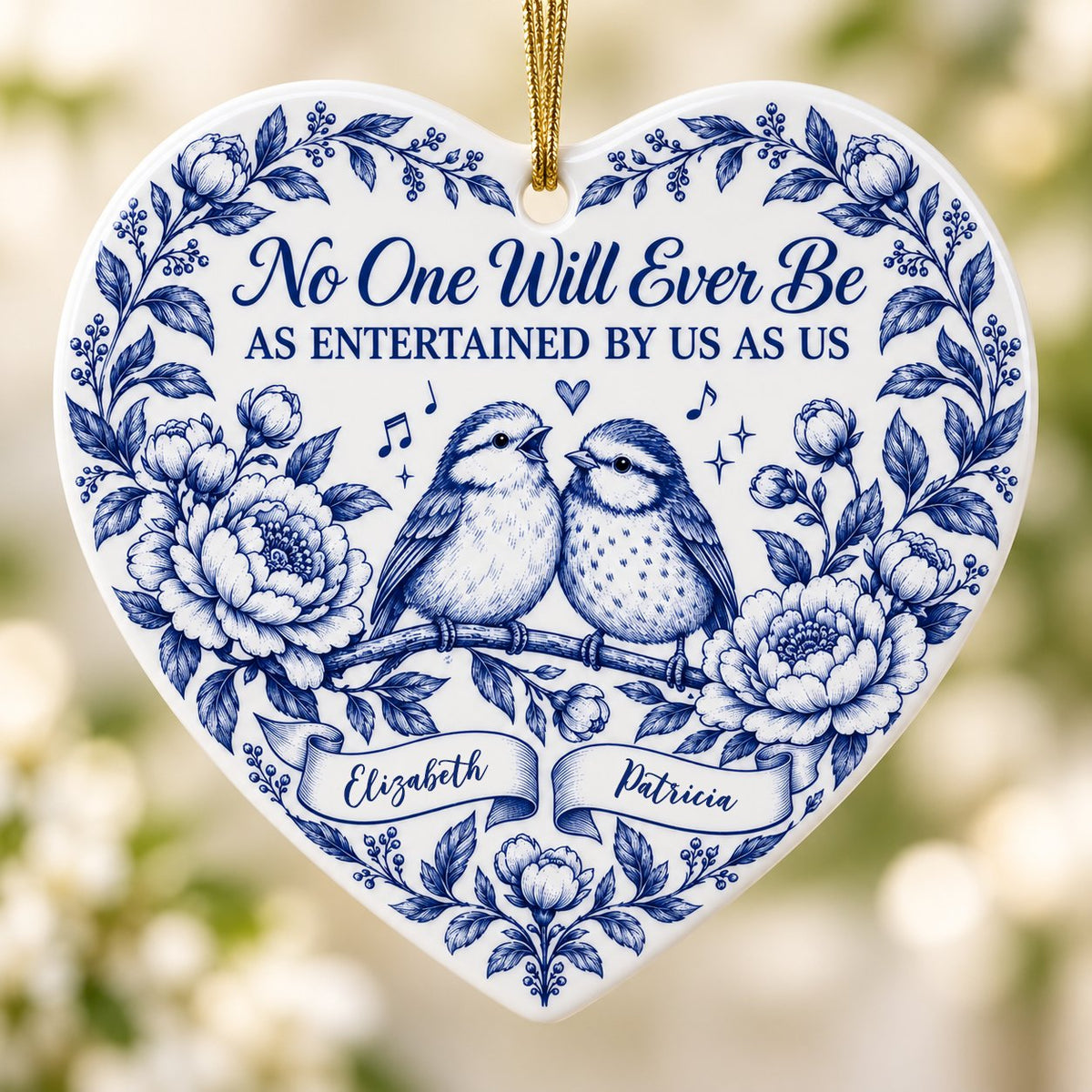 Heart ceramic ornament with two birds, blue floral frame, music notes above, and two name banners in cobalt.