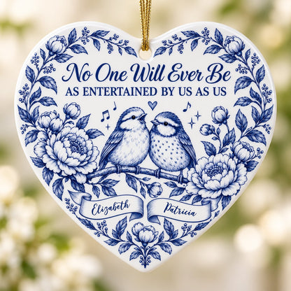 Heart ceramic ornament with two birds, blue floral frame, music notes above, and two name banners in cobalt.