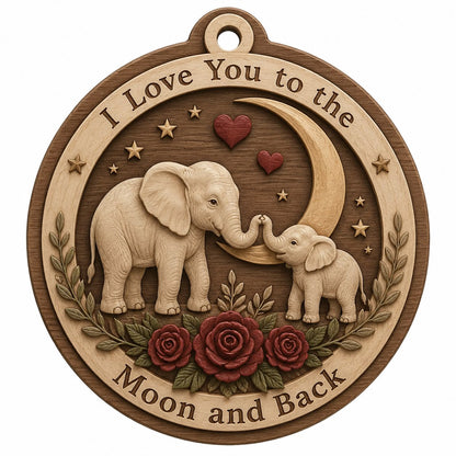 Round wood ornament with adult and baby elephants touching trunks under a crescent moon, red hearts, stars, and roses