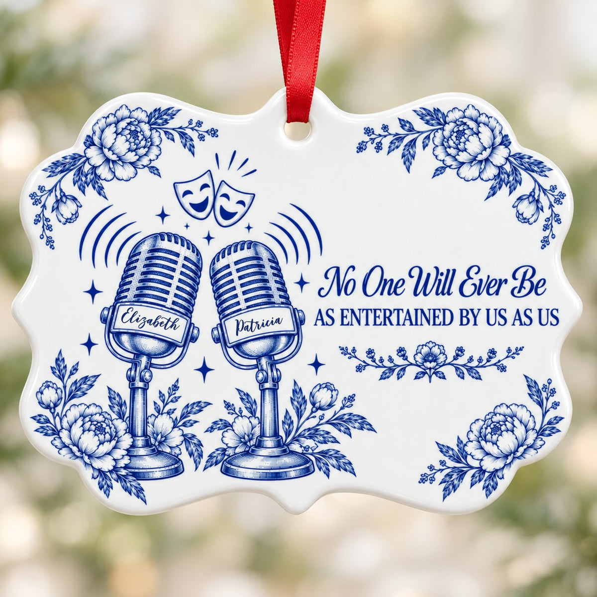 White ceramic ornament with cobalt blue vintage microphones, comedy and tragedy masks, stars and florals with two names.