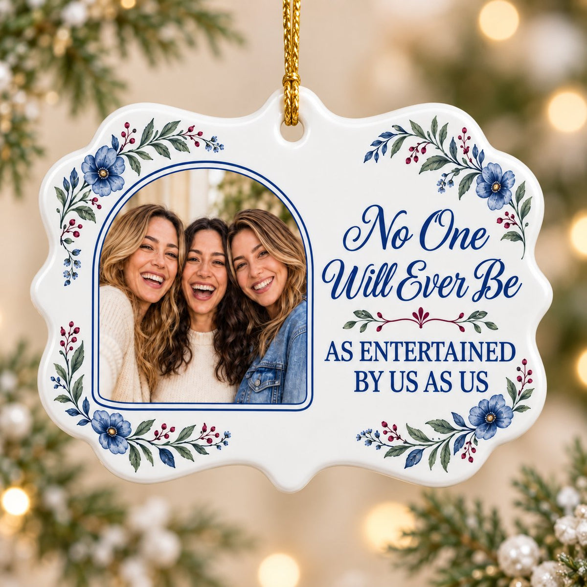 Blue floral ceramic ornament with navy photo frame and the text No One Will Ever Be As Entertained By Us As Us.