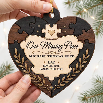 Heart wood ornament with puzzle-piece frame, Our Missing Piece title, laurel accents, personalized with name and dates.