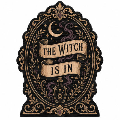 Gothic plaque sign reading "THE WITCH IS IN" with crescent moon, stars, purple smoke, potion bottle and ornate filigree 
