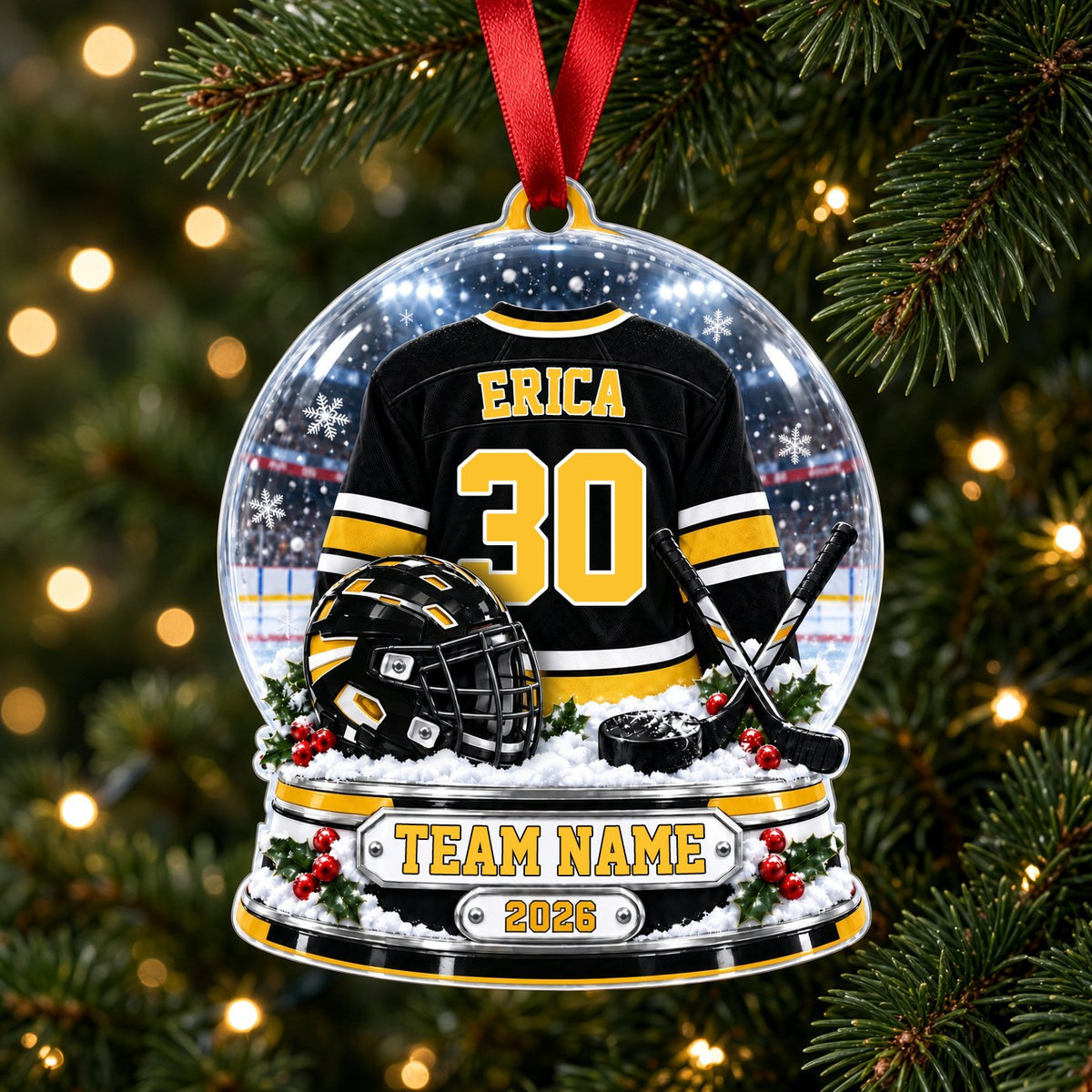Acrylic snow globe ornament with hockey jersey, helmet, crossed sticks, puck, holly, and a silver plaque base.