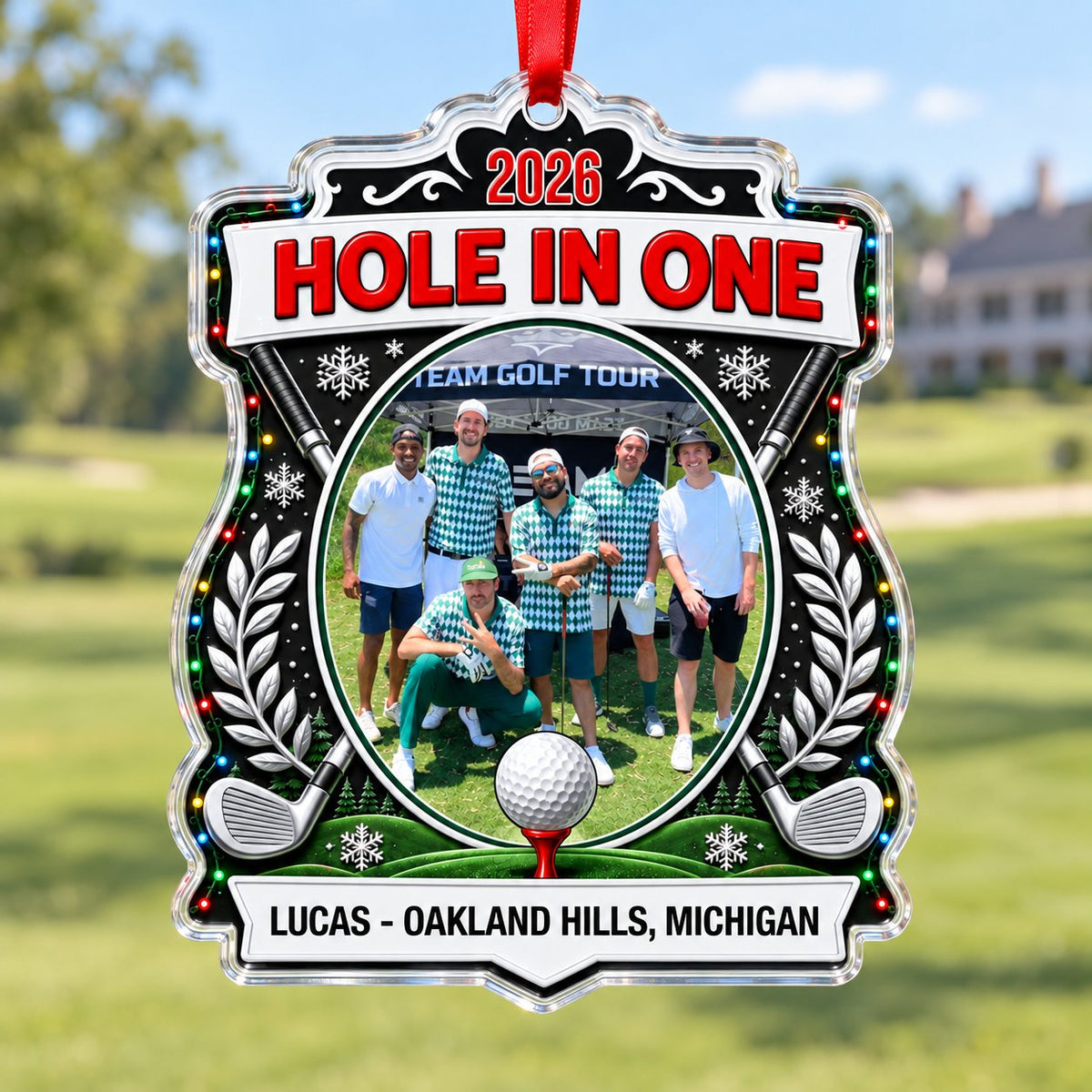 Acrylic crest ornament with golf photo, crossed clubs, Christmas lights, snowflakes, and HOLE IN ONE 2026 text.