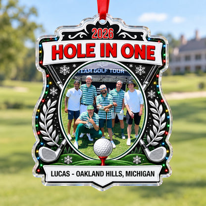 Acrylic crest ornament with golf photo, crossed clubs, Christmas lights, snowflakes, and HOLE IN ONE 2026 text.