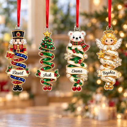 Custom-cut acrylic ornaments with a cartoon nutcracker and a praying angel wrapped in decorative ribbons.
