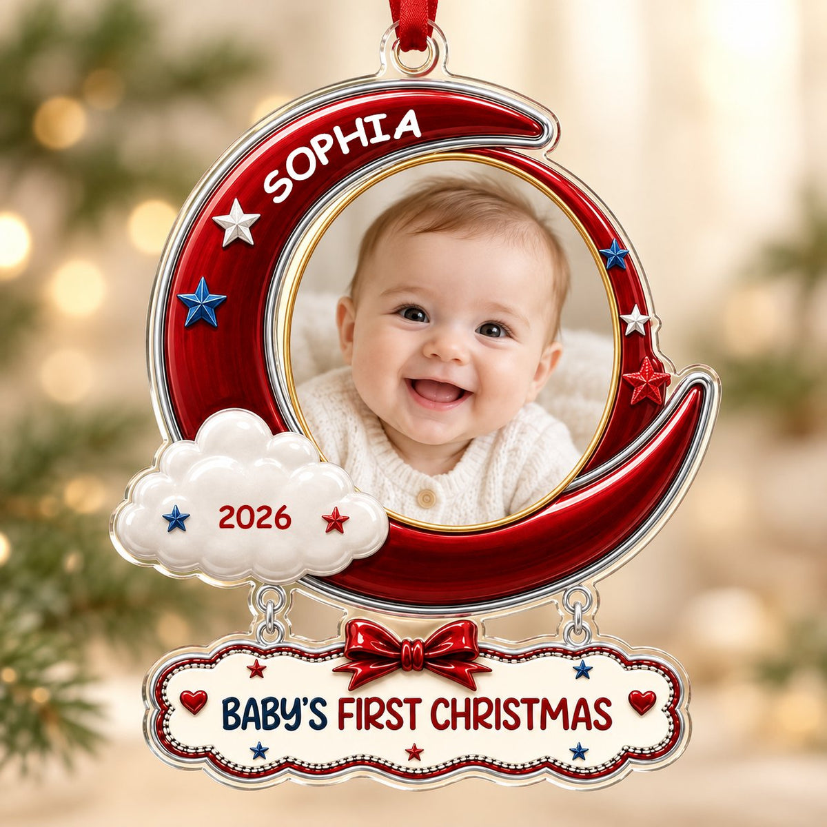 Red crescent moon acrylic ornament with baby photo, cloud, stars, and a plaque reading Baby's First Christmas.